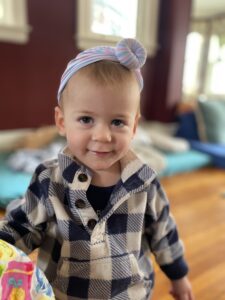 child in plaid pullover