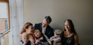 Three adults and three triplets posing for photo