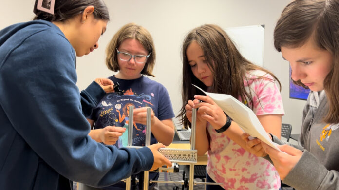 Children working with robotics