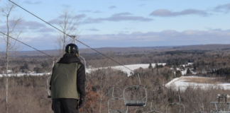 Man on top of ski hill