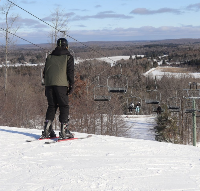 Man on top of ski hill
