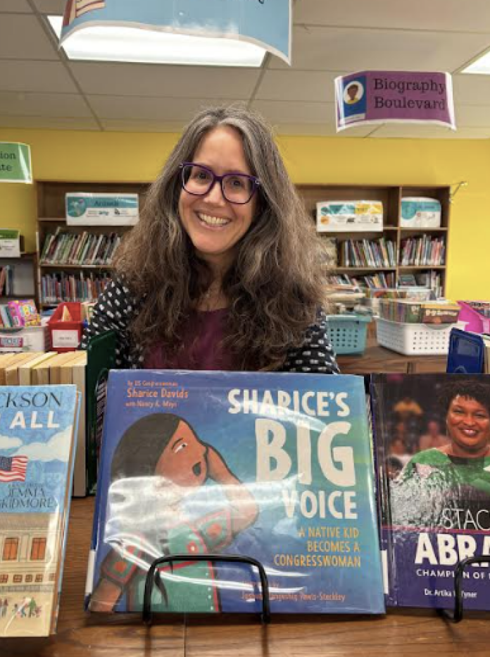 Woman in library with books