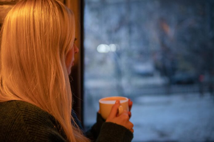 Women looking out window while rainy