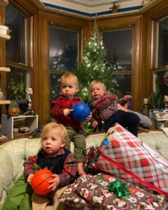 Triplets on Christmas with presents