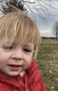 Young child in red sweatshirt