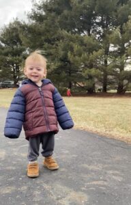 Child wearing oversized coat