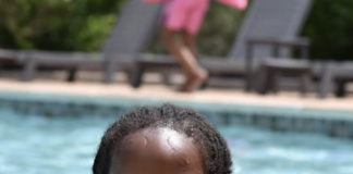 Young girl swimming with goggles