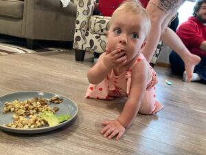 12 month old in overalls