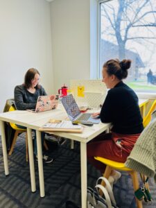 parents working at desks on laptops