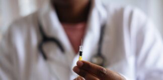 hands holding a vaccine