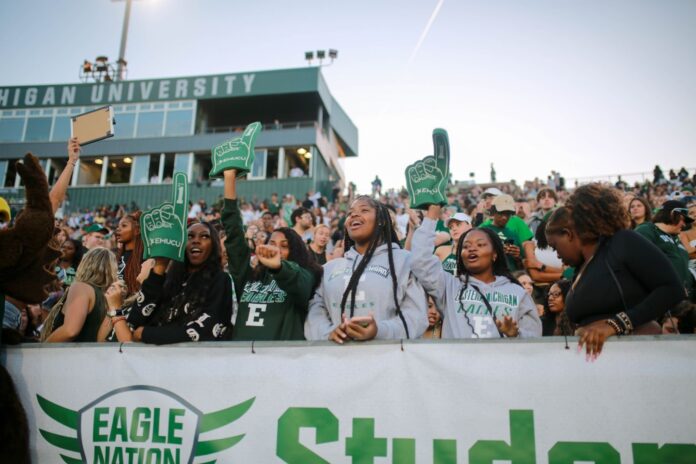 students at football game