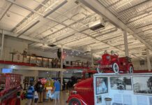 An entry way with a variety of historical fire trucks.