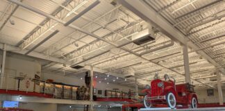 An entry way with a variety of historical fire trucks.