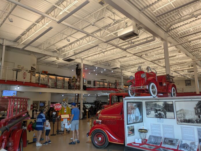 An entry way with a variety of historical fire trucks.