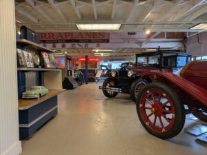 A room full of classic vintage cars. 